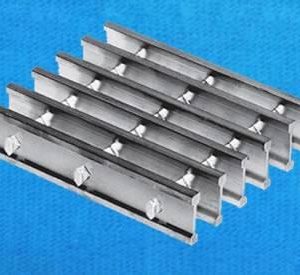 Swage-locked grating
